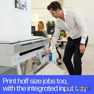 HP DesignJet XT950 36-in printer with man loading paper into integrated input tray