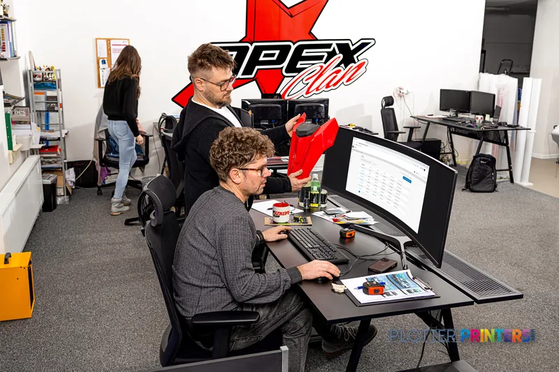 HP Latex 630 Print and Cut Plus Solution lifestyle image showing team members in a print shop workspace
