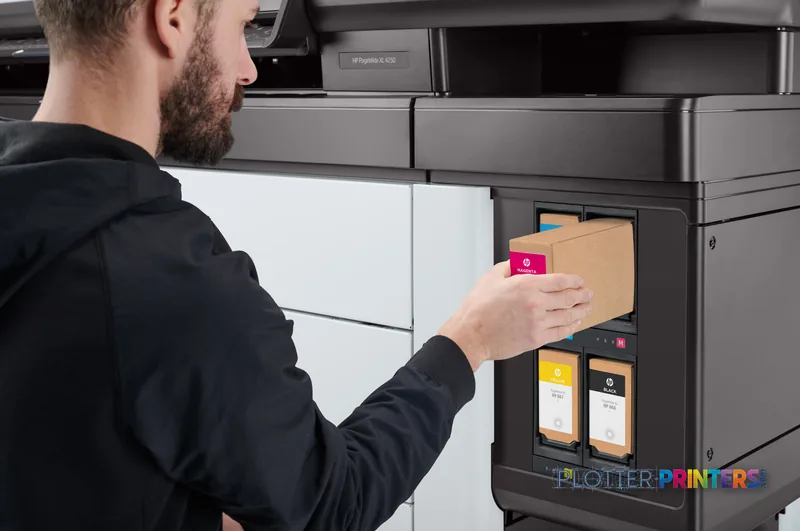 Man inserting ink cartridge into HP PageWide XL 4250 40-in Multifunction Printer lifestyle image