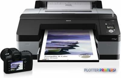 Epson Stylus Pro 4900 Designer Edition product image showing the printer with a landscape photo printing and a camera beside…