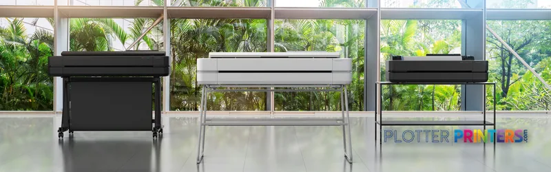 HP DesignJet T210 24-in Printer lifestyle image showing three units in a bright studio with large windows and greenery