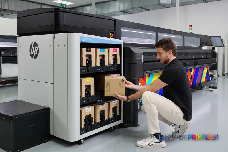 HP Latex FS50 Printer lifestyle image showing operator accessing ink cartridges from the front panel in a print facility
