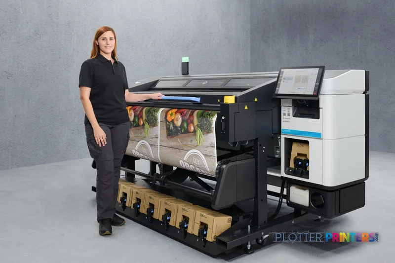 Woman standing beside HP Latex R530 Printer lifestyle image showing colorful fabric print output