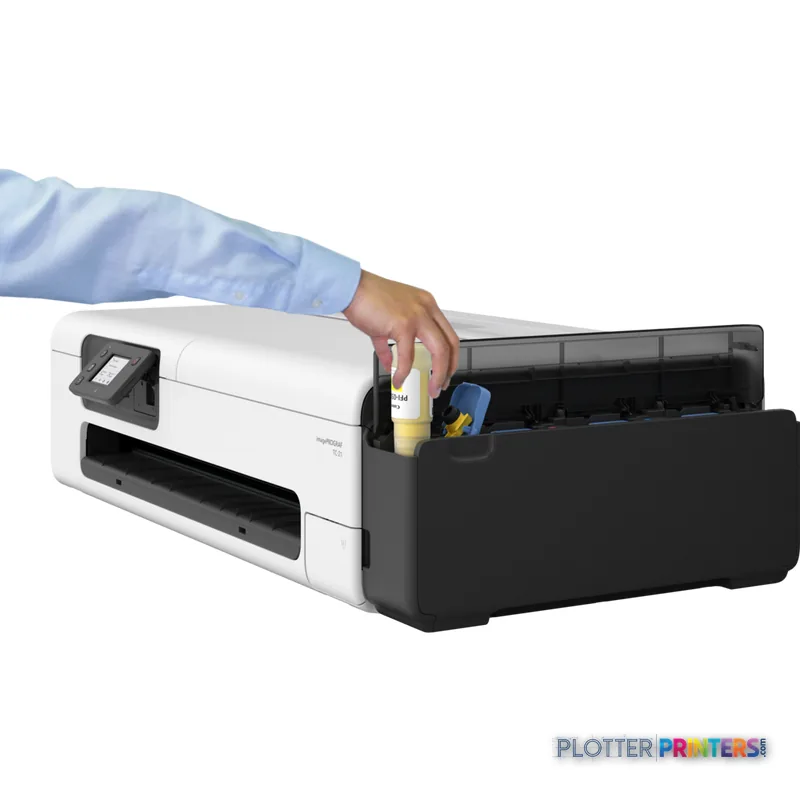 Canon imagePROGRAF TC-21 lifestyle image showing person accessing open ink cartridge tray on white and black printer