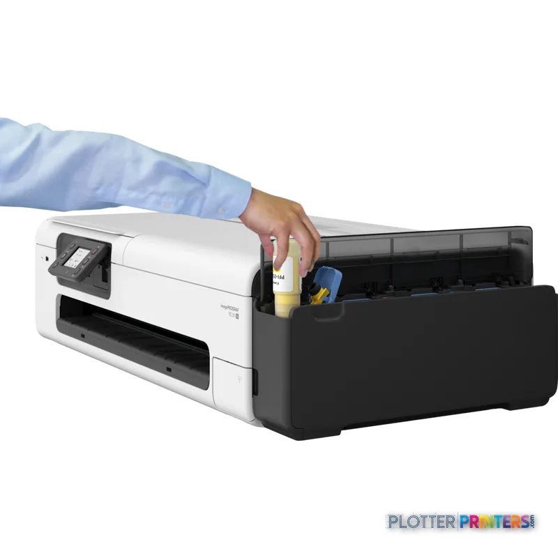 Canon imagePROGRAF TC-21M large format printer lifestyle image showing person accessing ink cartridges from open tray