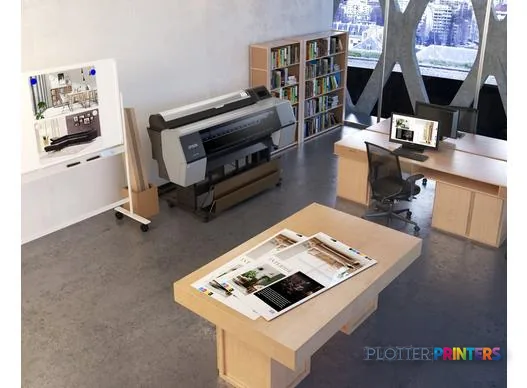 Epson SureColor P7300 large-format printer in a studio workspace with printed samples displayed on a wooden table