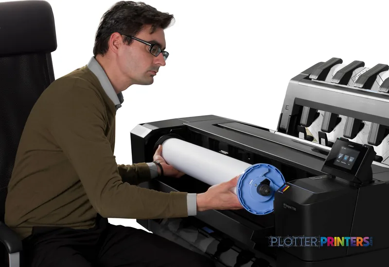 Man loading paper roll into HP Designjet T920 914 mm PS ePrinter lifestyle image
