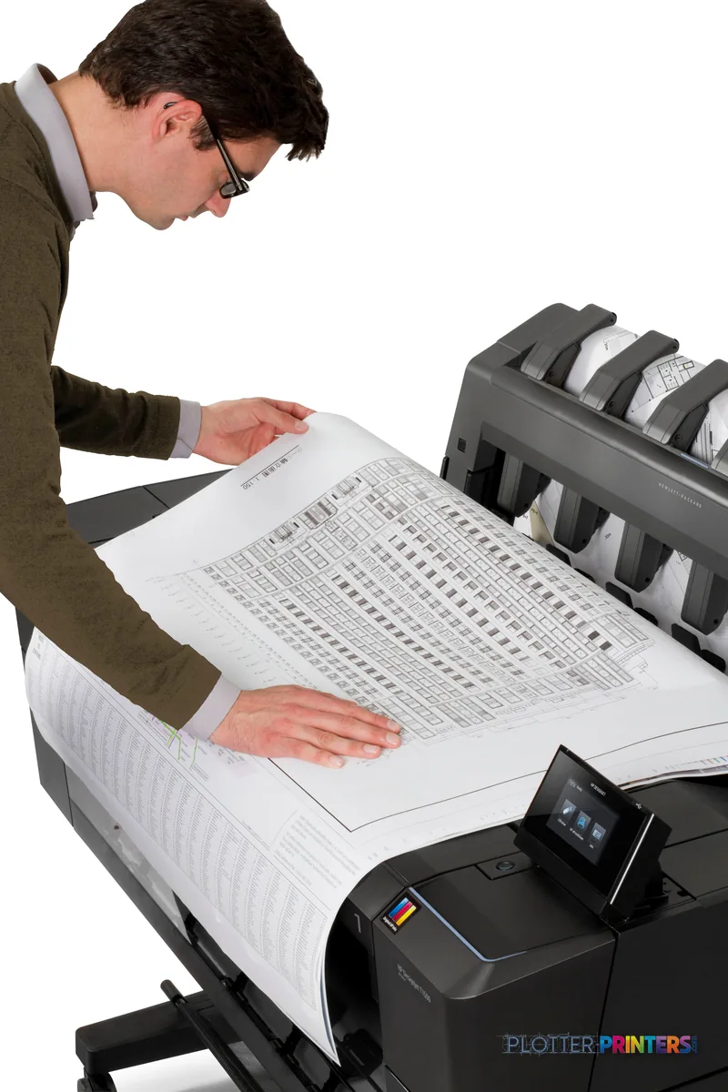 Man examining a large printed document from the HP Designjet T1500 36-in PS ePrinter, lifestyle view