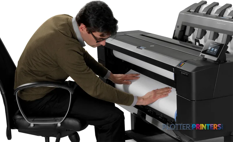 Man examining large format print output from HP Designjet T1500 36-in PS ePrinter