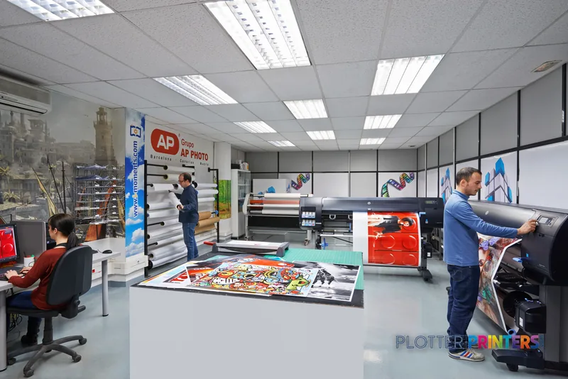 HP Designjet Z6800 large format printer in a professional print shop environment with staff handling printed materials