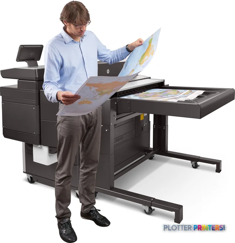Man examining large color printout from HP PageWide XL 8000 printer in office setting