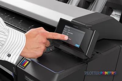 HP Designjet T2530 lifestyle image showing a user operating the touchscreen control panel