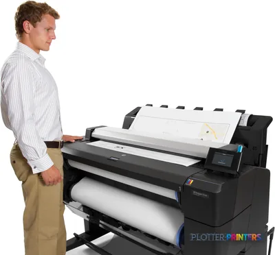 HP Designjet T2530 lifestyle image showing a man operating the large-format printer with a printed document visible on top