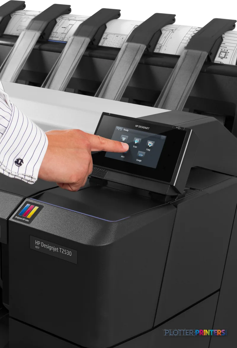 HP Designjet T2530 lifestyle image showing a person's hand operating the printer's control panel