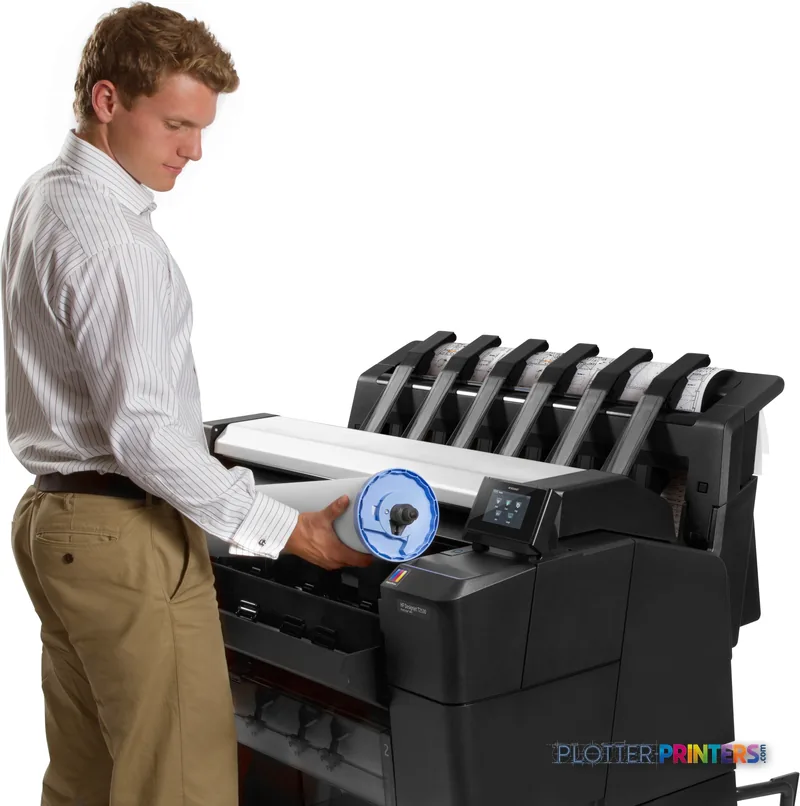Man loading a large format print into an HP Designjet T2530 printer in a lifestyle setting