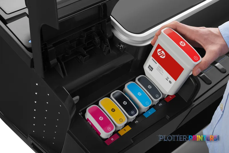 HP Designjet Z5600 44-in lifestyle image showing ink cartridge replacement with colored cartridges displayed