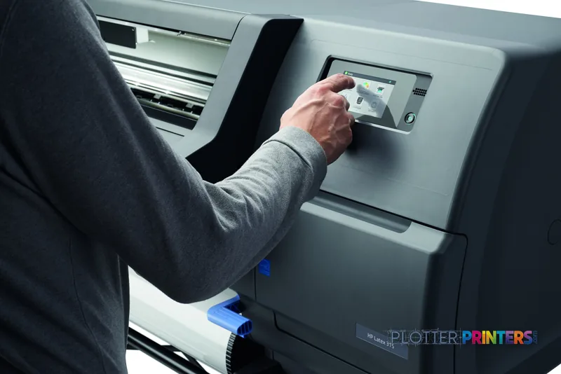 HP Latex 315 Printer lifestyle image showing a user operating the touchscreen control panel on the grey printer