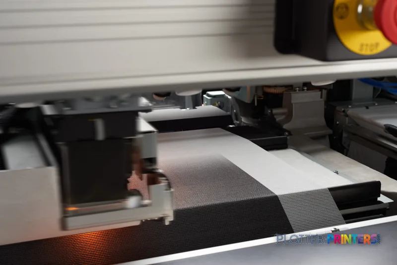 HP Latex 3600 Printer internal view showing print head and media path with black and white material