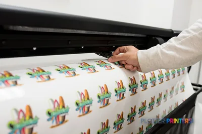 HP Latex 315 Print and Cut Solution lifestyle image showing colorful printed designs being cut on the grey printer