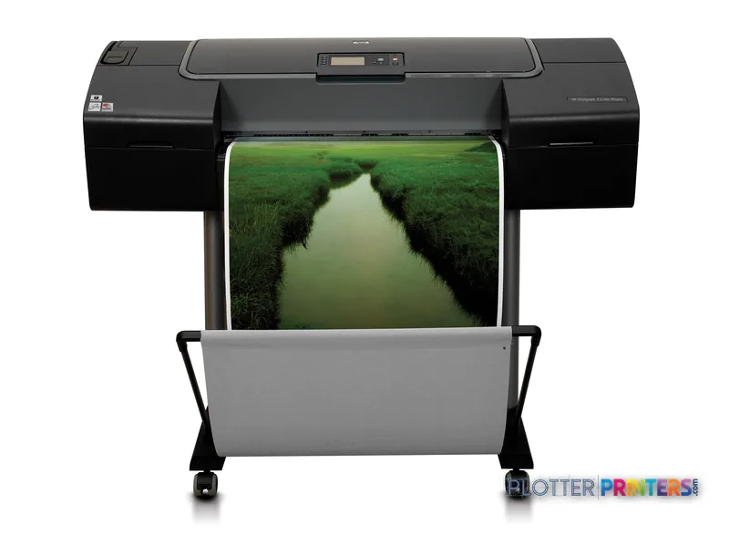 HP Q6675C large format printer product image showing black printer with color landscape photo printing on roll media