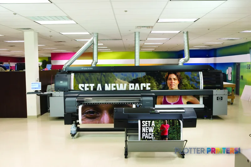 HP Designjet Z2100 24-in Photo Printer lifestyle image showing the printer in a studio setting with vibrant color samples di…