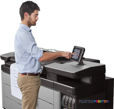 Man operating HP PageWide XL 5100 large format printer via touchscreen control panel in office setting