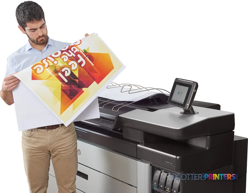 Man holding a large colorful printed document next to the HP PageWide XL 5100 printer in lifestyle setting