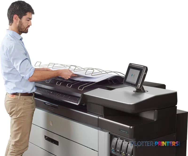 Man feeding large-format print into HP PageWide XL 5100 printer lifestyle image