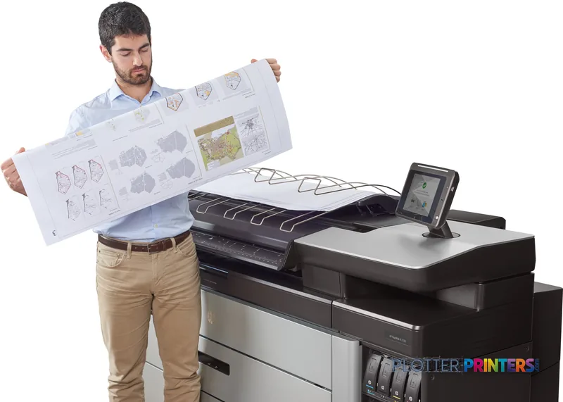 Man holding large printed architectural drawings next to HP PageWide XL 5100 printer in lifestyle setting