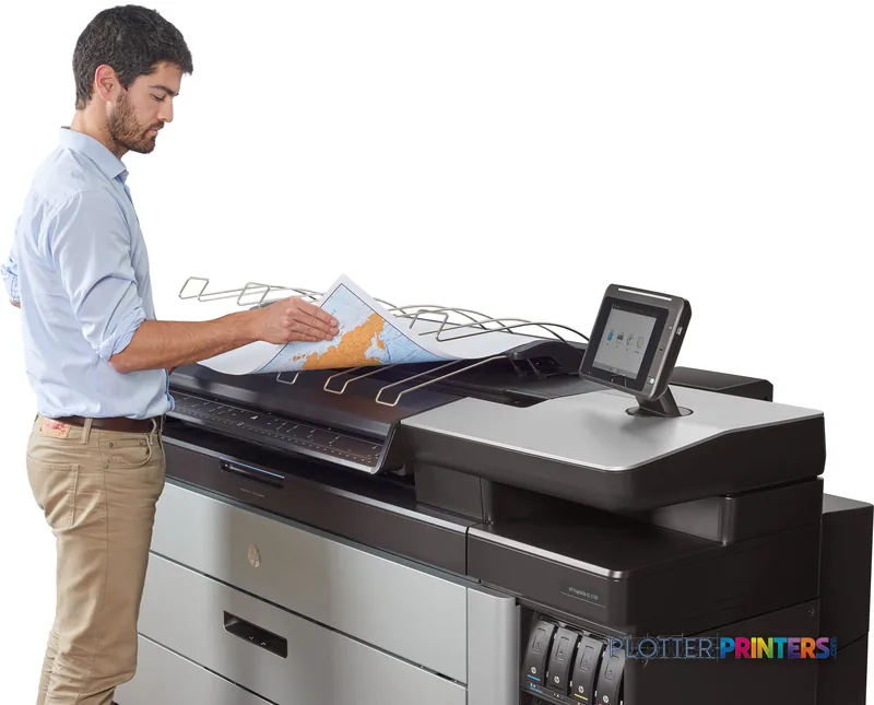 Man examining large color print output from HP PageWide XL 5100 printer in lifestyle setting