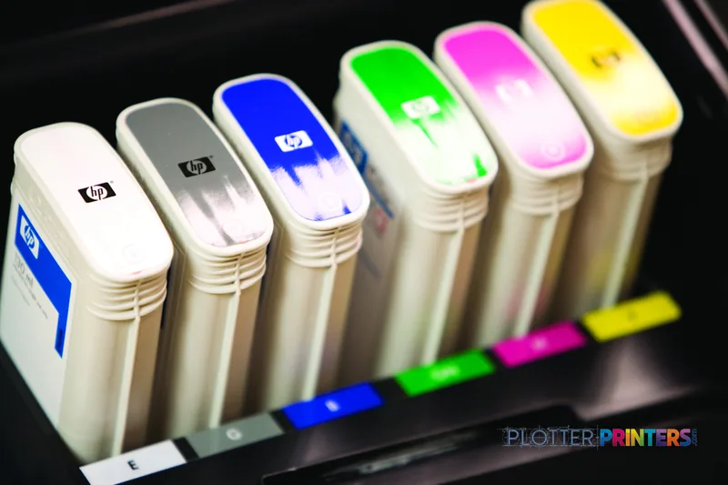 HP DesignJet Z2100 24 in lifestyle image showing ink cartridges in various colors arranged in a row