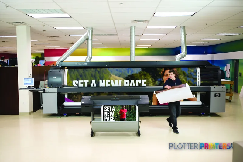 HP DesignJet Z2100 24 in GP Photo Printer lifestyle image showing large-format prints in a modern office setting
