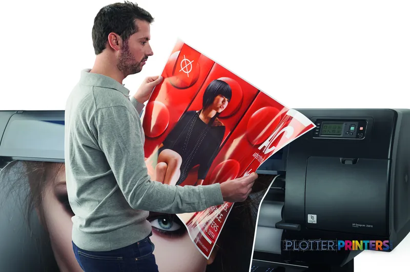Man holding a large red printed poster from an HP DesignJet Z6810 60-in printer in a lifestyle setting
