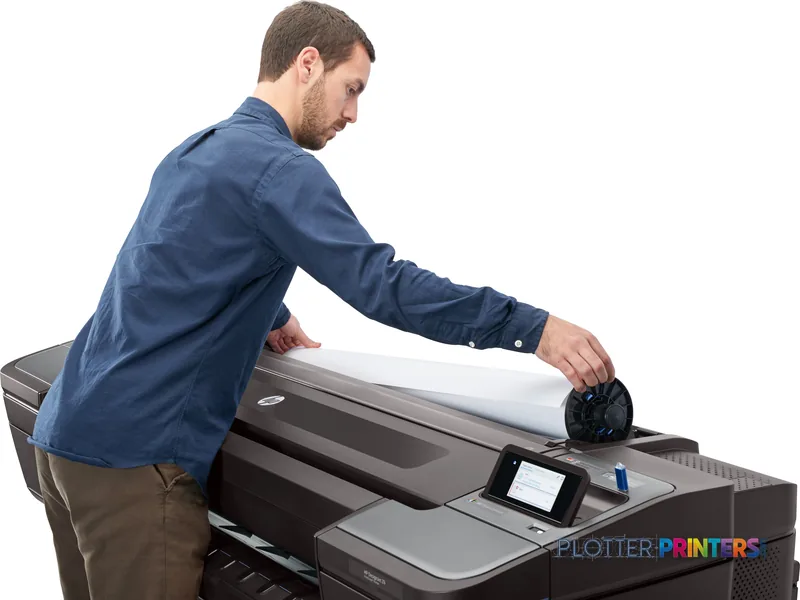 Man unrolling large-format print from HP DesignJet Z6 24-in PostScript Printer in lifestyle setting