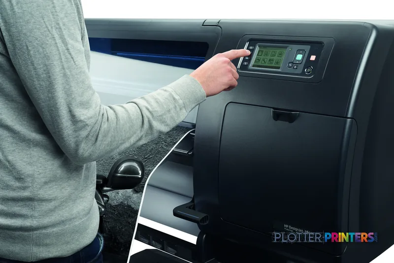 User operating the control panel of an HP Designjet Z6610 60-in printer in a lifestyle setting