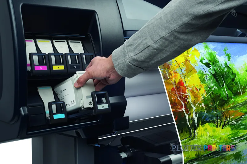 HP DesignJet Z6610 60-in Production Printer lifestyle image showing operator accessing ink cartridges with vibrant landscape…