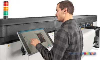 HP Latex R2000 Plus Printer lifestyle image showing operator using touchscreen control panel