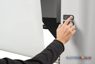 HP Latex R2000 Plus Printer lifestyle image showing a hand operating the control panel