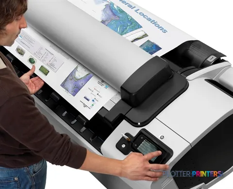 HP Designjet T2300 large format printer product image showing operator using the device with color prints
