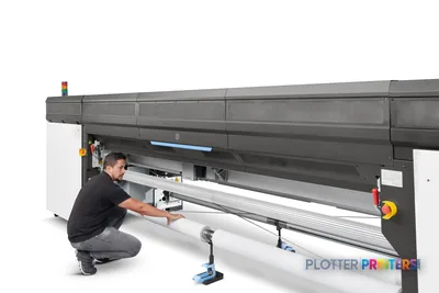 HP Stitch S1000 126-in Printer lifestyle image showing technician operating the large-format printer