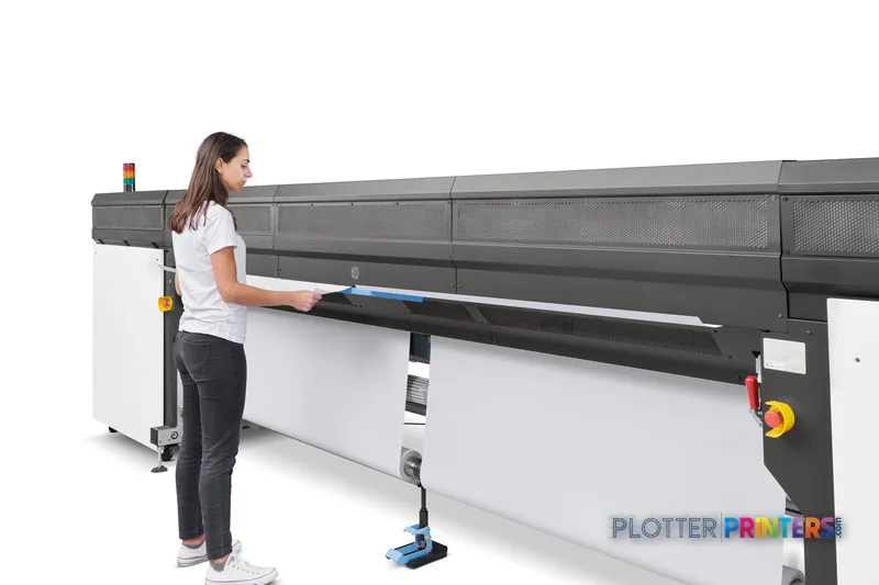 HP Stitch S1000 126-in Printer lifestyle image showing operator loading media into the black large-format printer