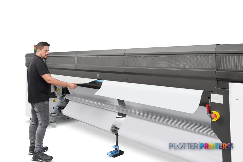 HP Stitch S1000 126-in Printer lifestyle image showing operator unrolling printed material from the black large-format print…