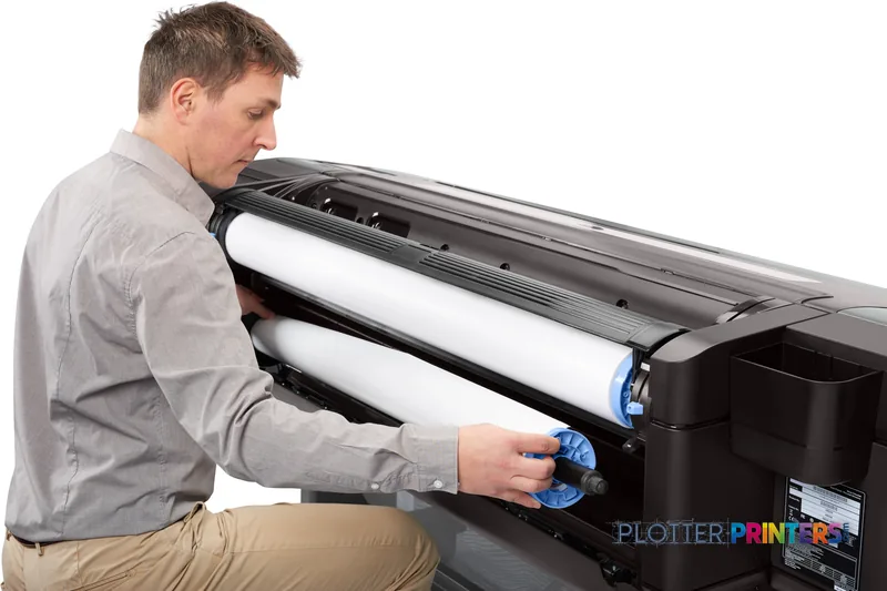 Man loading paper roll into HP DesignJet Z9+ 24-in PostScript Printer in lifestyle setting