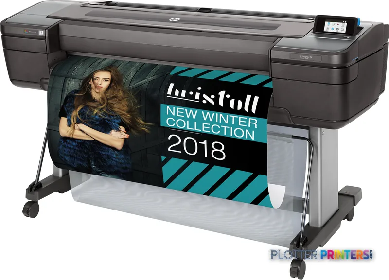 HP DesignJet Z9+dr 44-in PostScript Printer front-left view with black and silver chassis printing a fashion banner