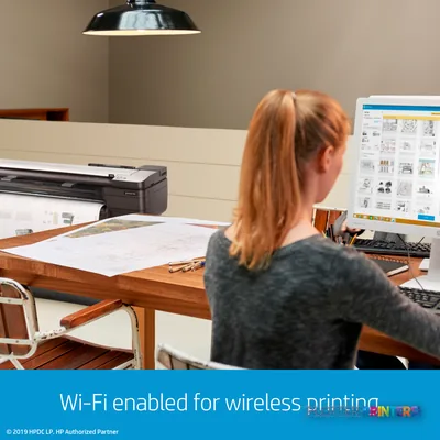 HP DesignJet T830 24-in printer in office workspace with large-format prints