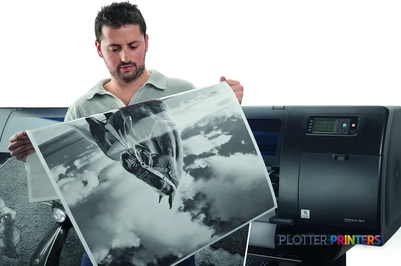 Man holding large-format black and white print from HP DesignJet Z6810 42-in printer in lifestyle setting