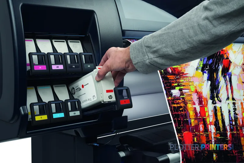 HP DesignJet Z6810 42-in Production Printer lifestyle image showing operator accessing ink cartridges with vibrant color out…