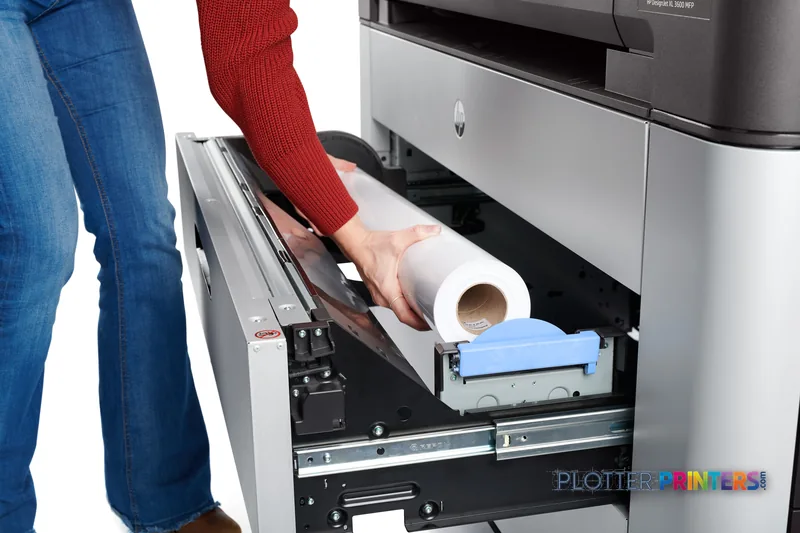 HP DesignJet XL 3600dr 36-in printer lifestyle image showing a person loading a roll of paper into the front tray
