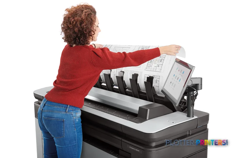 Person using HP DesignJet XL 3600dr 36-in Multifunction Printer to retrieve large-format architectural prints