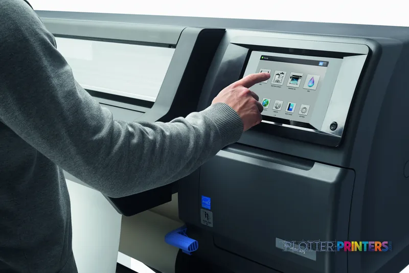 User operating the touchscreen control panel on an HP Latex 375 Printer Europe in a lifestyle setting